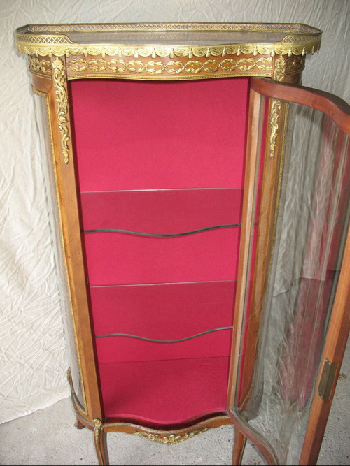 Curved display case in the Louis XVI style, 19th century