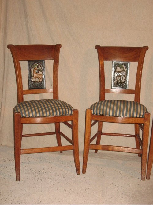 Suite of 4 chairs in cherry wood decorated with animals from the 4 continents