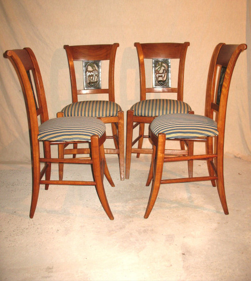 Suite of 4 chairs in cherry wood decorated with animals from the 4 continents