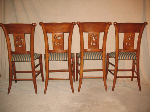 Suite of 4 chairs in cherry wood decorated with animals from the 4 continents