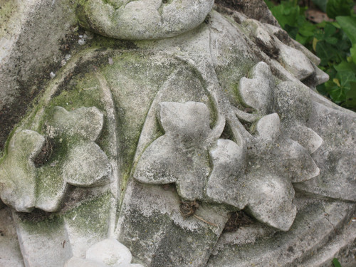 Pair of gothic style stone wall brackets decorated with plants