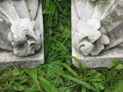 Pair of gothic style stone wall brackets decorated with plants