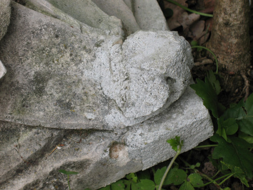 Pair of gothic style stone wall brackets decorated with plants