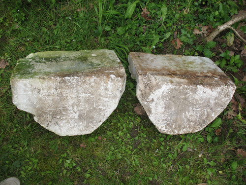 Pair of gothic style stone wall brackets decorated with plants