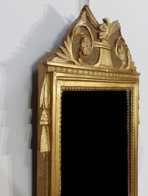 Miroir en bois doré, style louis XVI – Début XXe