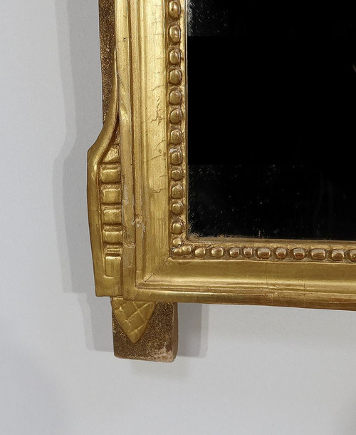 Miroir en bois doré, style louis XVI – Début XXe