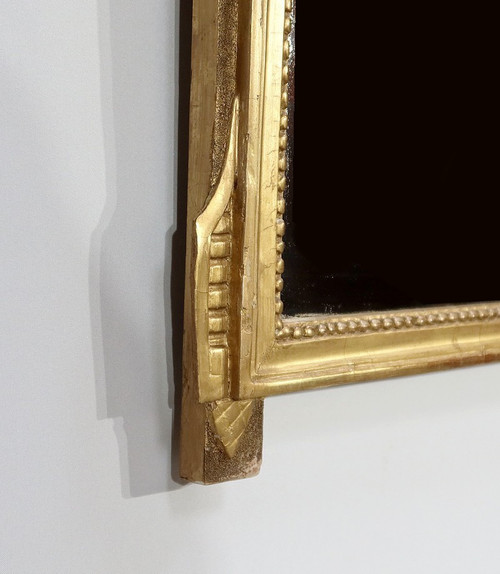 Miroir en bois doré, style louis XVI – Début XXe