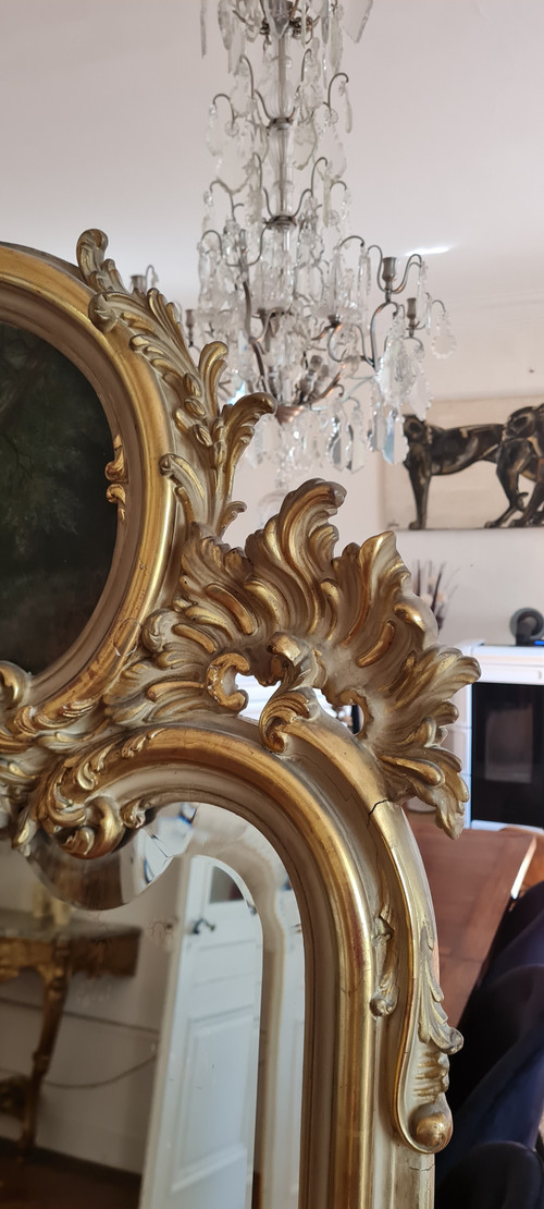 Trumeau mirror in patinated gilded wood