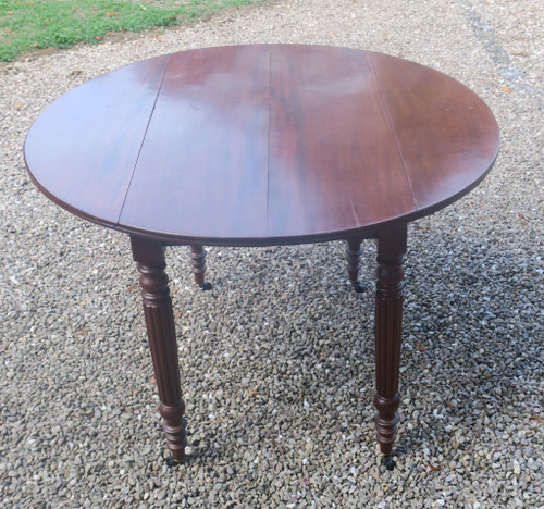 Round mahogany table with extension leaf