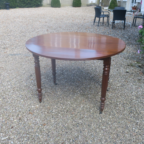 Round mahogany table with extension leaf