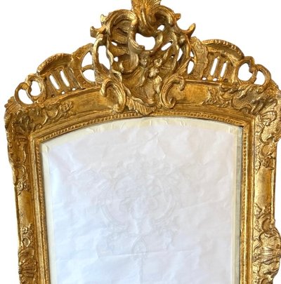 18th century Regence period carved and gilded wood mirror