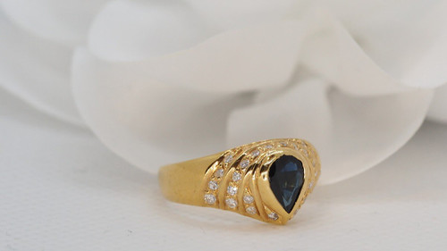 Yellow Gold Ring Set With A Pear Sapphire And Diamonds