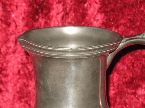 Pewter water jug in the shape of a caterpillar baluster early 18th century