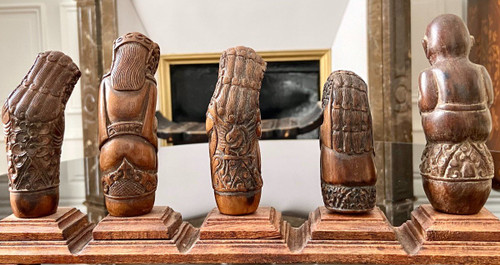 Indonesia, 19th Century, Five Carved Wood Kriss Handles with Anthropo-zoomorph decoration.