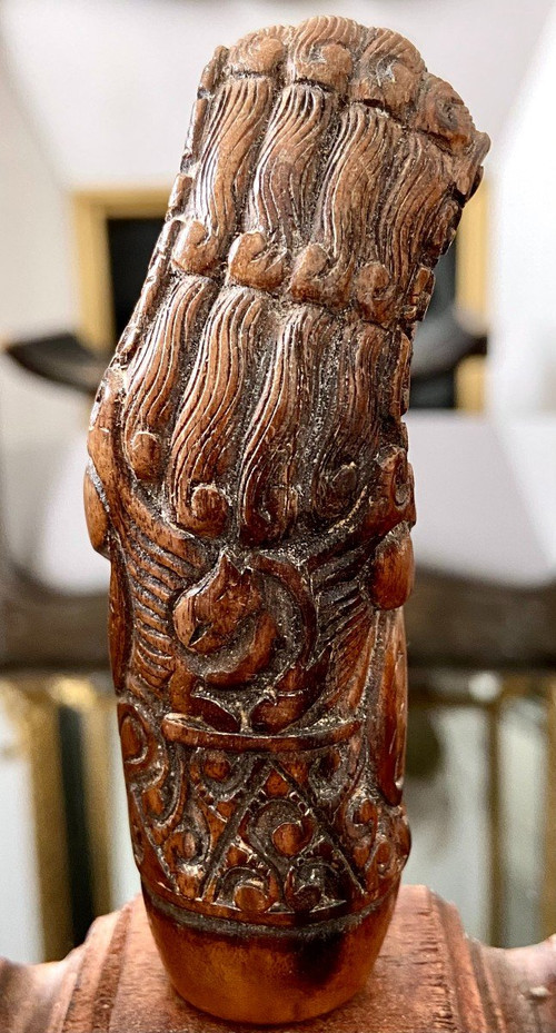 Indonesia, 19th Century, Five Carved Wood Kriss Handles with Anthropo-zoomorph decoration.