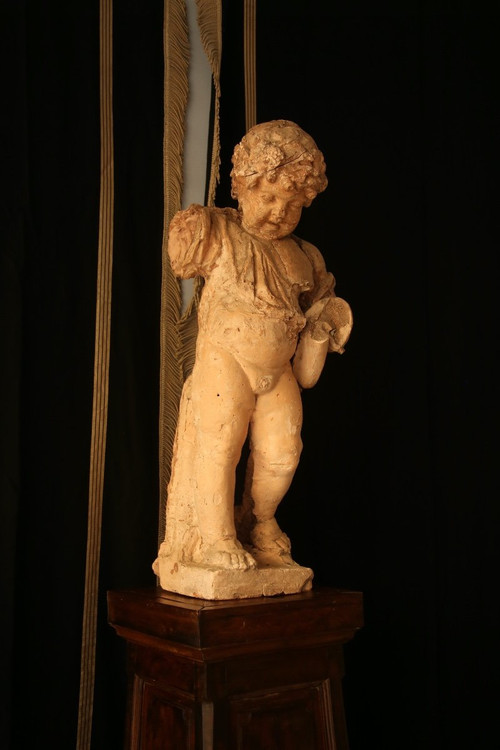 Scultura In Gesso Colorato Raffigurante Un Putto.