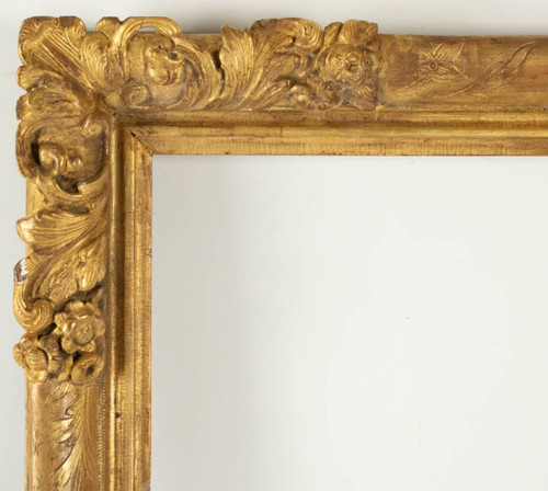 Louis XIV period carved and gilded wood frame with flowered corners, late 17th century