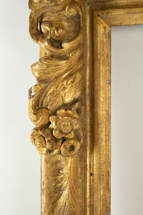 Louis XIV period carved and gilded wood frame with flowered corners, late 17th century