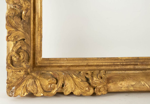 Louis XIV period carved and gilded wood frame with flowered corners, late 17th century