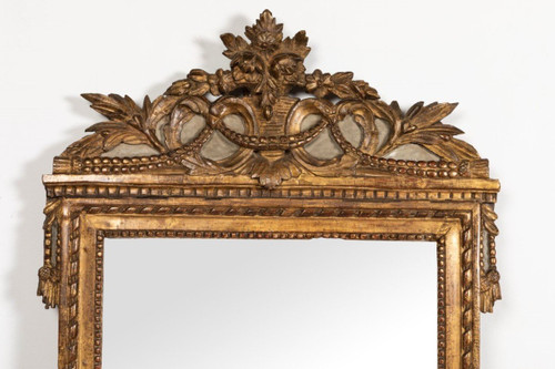 Louis XVI period carved giltwood mirror