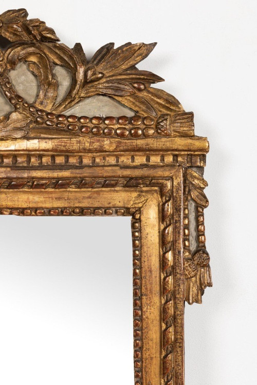 Louis XVI period carved giltwood mirror