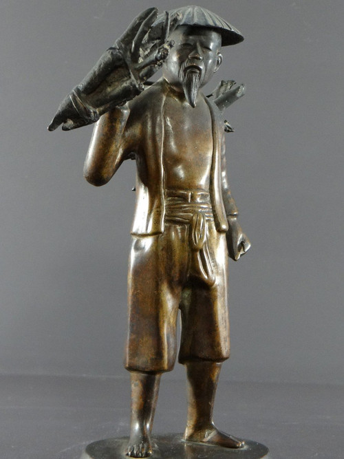 Vietnam, Early 20th Century, Bronze Statuette Peasant Carrying Fagots.