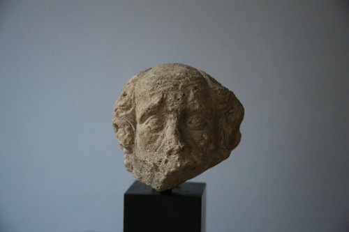 Carved stone head, 15th century.