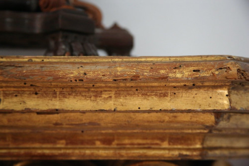 Large wall console in gilded wood, Italian work in the Baroque style.