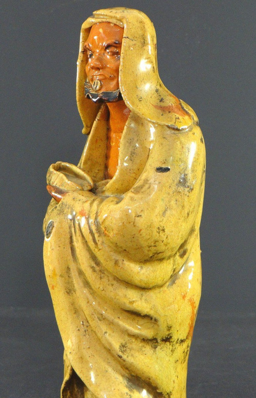 China, Early 20th Century, Glazed Earthenware Arhat Statue.