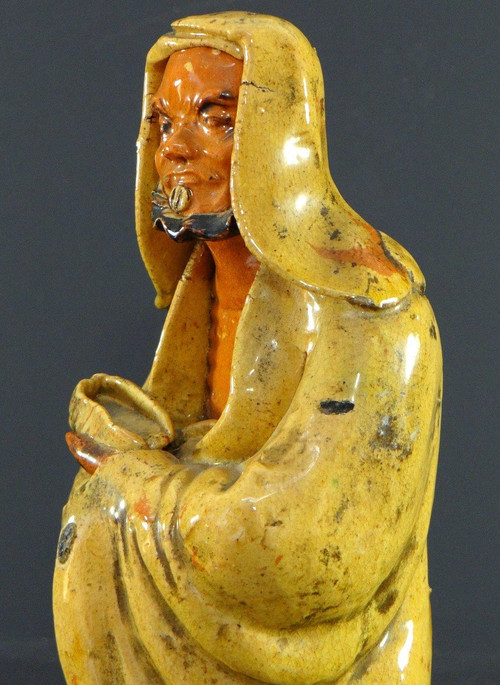 China, Early 20th Century, Glazed Earthenware Arhat Statue.