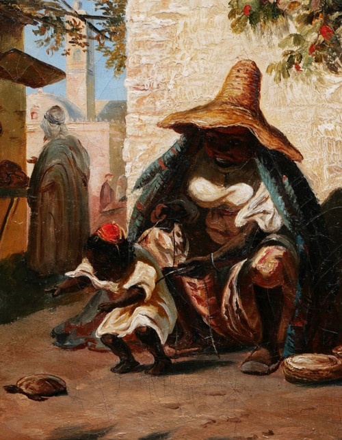 Juliette G., Woman from Morocco and her child playing with a turtle