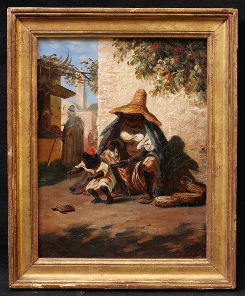 Juliette G., Woman from Morocco and her child playing with a turtle