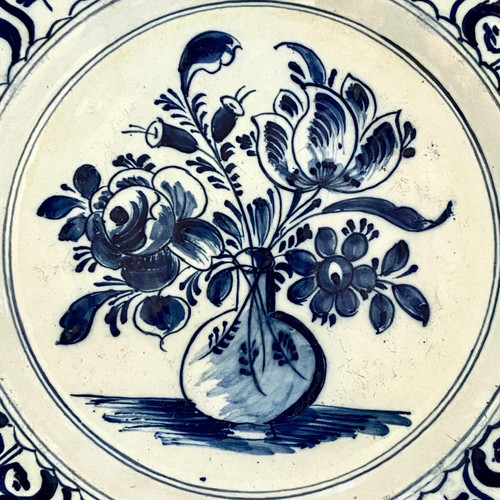 Delft, 18th Century, Earthenware Dish Decorated With Flowered Bottle Vase.