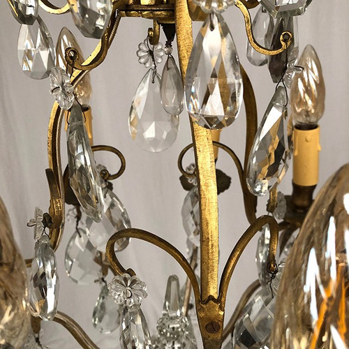 Cage chandelier in gilded brass and glass pendants