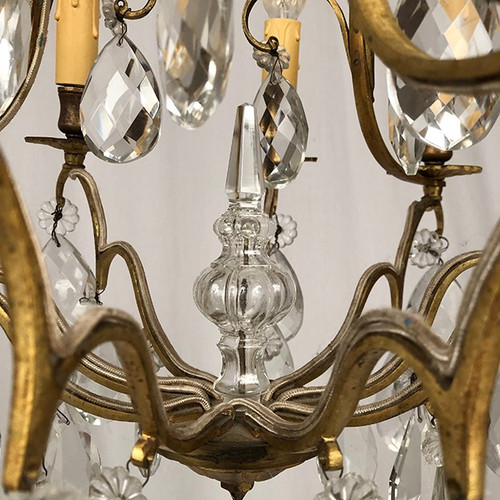 Cage chandelier in gilded brass and glass pendants