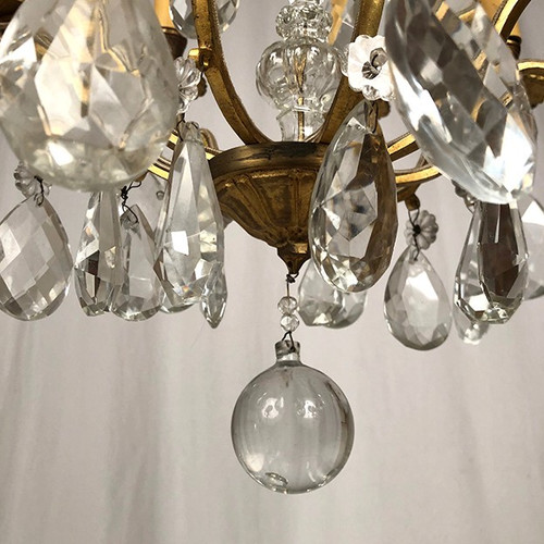 Cage chandelier in gilded brass and glass pendants