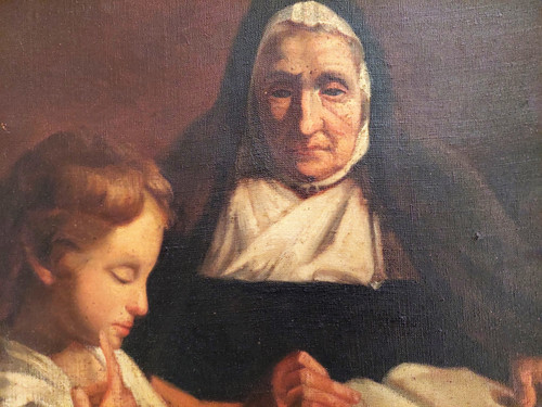 Oil on canvas scene of a nun giving a catechism lesson to a child