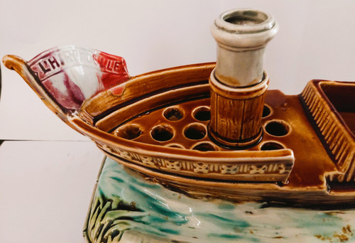 Steamboat centerpiece with flower spikes in barbotine 1900