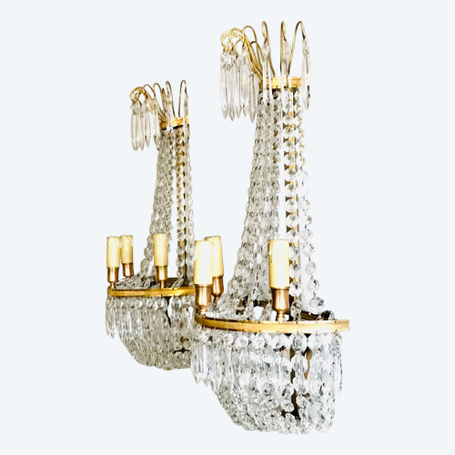 Important pair of empire style crystal and gilded bronze wall lights