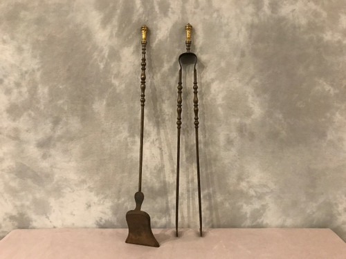 Set of a shovel and tongs in iron and gilded bronze from the 19th century in Louis XVI style