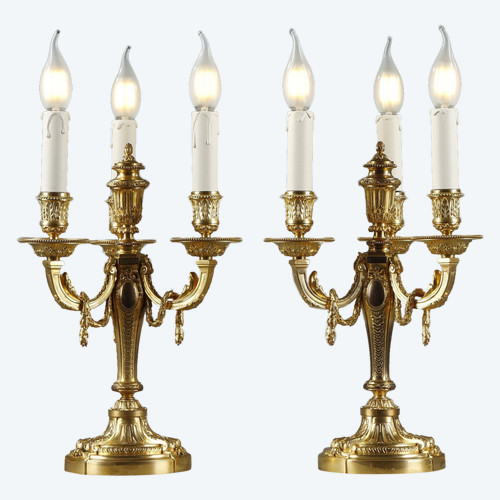 Pair of gilded bronze and chased candelabra 