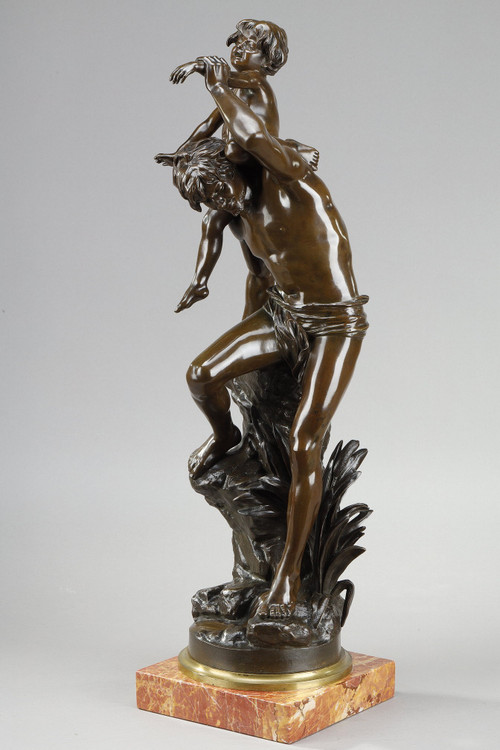 BROWN PATINA BRONZE OF A MAN CARRYING A CHILD ON HIS BACK, BY GASTON LEROUX (1854-1942)