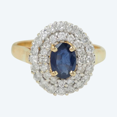 Surrounding ring in yellow gold, oval sapphire and diamonds