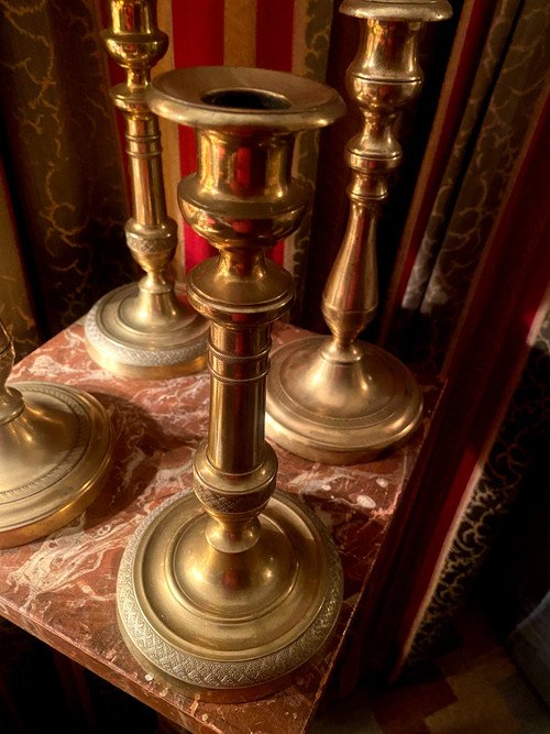 Two pairs of elegant Restoration-period polished bronze guilloche candlesticks