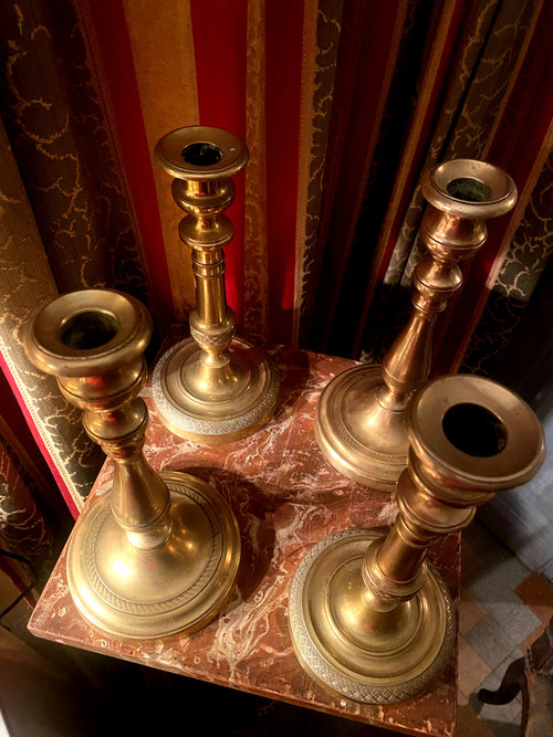 Two pairs of elegant Restoration-period polished bronze guilloche candlesticks