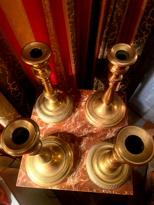 Two pairs of elegant Restoration-period polished bronze guilloche candlesticks