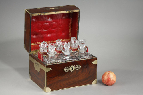 FLAMED MAHOGANY LIQUEUR CELLAR WITH CUT CRYSTAL BOTTLES AND GLASSES