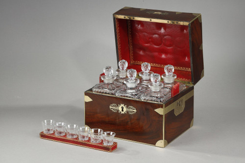 FLAMED MAHOGANY LIQUEUR CELLAR WITH CUT CRYSTAL BOTTLES AND GLASSES