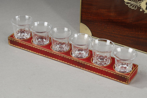 FLAMED MAHOGANY LIQUEUR CELLAR WITH CUT CRYSTAL BOTTLES AND GLASSES