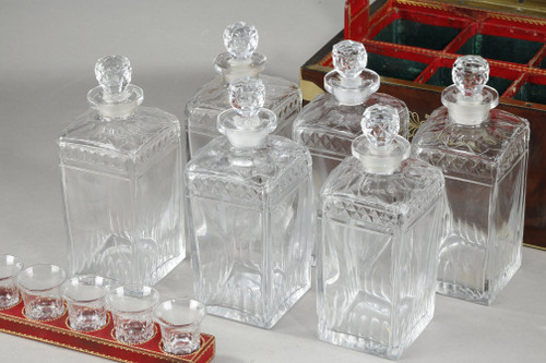 FLAMED MAHOGANY LIQUEUR CELLAR WITH CUT CRYSTAL BOTTLES AND GLASSES